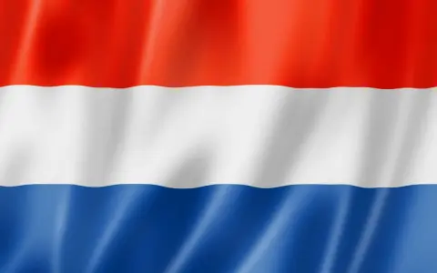 Nederlandse vlag golft. Droom je van praca w holandii od zaraz bez języka? Hier vind je kansen!